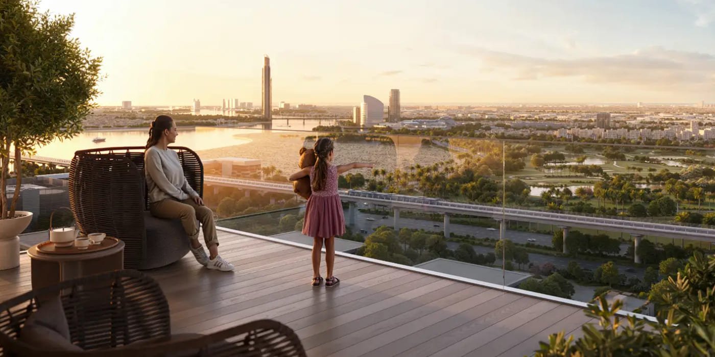 Residents on a landscaped podium terrace at Valia looking over the creek towards the city at sunrise